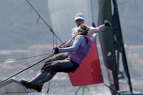 Rebecca Netzler and Vilma Bobeck celebrate winning the silver medal in women's skiff race